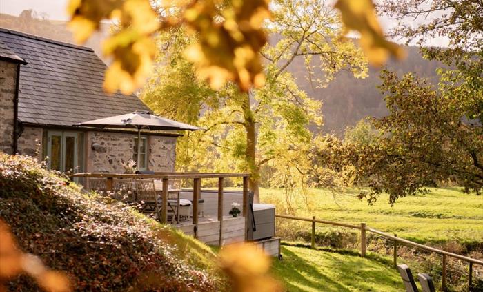 An autumn day looking out over the garden of Flyfishers Cottage